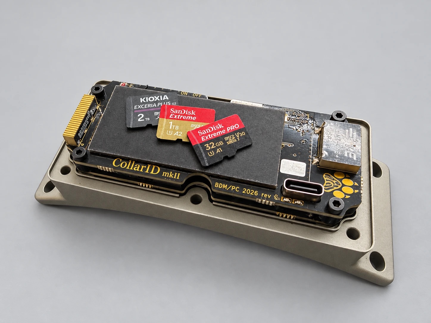 Three of the cards we tested, a Kioxia Exceria Plus 2 TB, a SanDisk Extreme 1 TB and a SanDisk Extreme Pro 32 GB, lying on an open CollarID